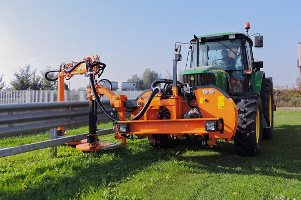 A brush cutter and grass trimmer designed for professional mowing of vegetation near obstacles along the roadside.